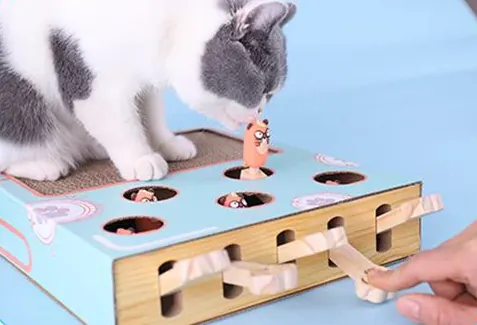 <p style="font-weight: 400;">Offrez à votre félin le summum du divertissement sans fin avec ce griffoir et jouet chat interactif.</p> <p style="font-weight: 400;"><span style="font-weight: 400;">Conçu pour prolonger ses heures de joie et d’exercice tout en satisfaisant son instinct de grattage. </span> [cg_accordion title="Matériau"] Bois Massif + Papier Carton + Silicone [/cg_accordion] [cg_accordion title="Avantage"]</p> <ul style="font-weight: 400;"> <li>C’est un griffoir et jouet chat interactif 2 en 1 alliant grattoir et jeu dans un seul produit</li> <li>Il pourra stimuler l’intelligence de votre félin en associant la pression sur un clavier avec la réaction d’une taupe surélevée</li> <li>Ayant une variété de divertissement, que ce soit pour jouer tout seul ou avec vous</li> <li>Combinaison du bois massif, du papier carton et de la silicone pour une touche confortable, une sécurité optimale et un usage durable</li> <li>Ce griffoir chat carton est son compagnon ludique, surtout pendant vos absences (anti stresse/solitude) [/cg_accordion] [custom_combined_shortcode title=" Guide de tailles" id="32073"] [cg_accordion title="Livraison"] La livraison s’effectuera dans un délai de 7 à 28 jours ouvrables dès la validation de votre commande. <span lang="FR"> </span>[/cg_accordion][cg_accordion title="Retour"] Si, pour quelque raison que ce soit, vous n'êtes pas pleinement satisfait, une demande de retour serait possible dans les 14 jours suivant la réception.[/cg_accordion]</li> </ul>