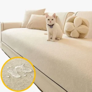 Protège canapé écru avec chat et gouttes d'eau qui ne pénètrent pas le tissu grâce à la membrane TPU