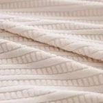 Housse-Canapé-Anti-Griffes-Granulés-Velours-tissu-detail Housse Canapé Anti-Griffes Granulés Velours Installation Rapide tissu detail