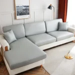 Housse Canapé Simili-Cuir gris clair, canapé d'angle en situation dans salon chic