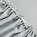 Housse Canapé Simili-Cuir gris, gros plan couture élastique et fixation facile
