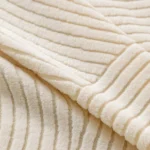 gros-plan-tissu-creme-housse-anti-griffes Gros plan extrême du tissu crème de la Housse Canapé Jacquard Spirale, texture et relief du motif