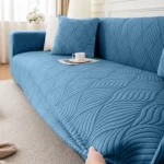 housse-canape-bleu-confortable Ajustement de la Housse Canapé Jacquard Ondulé bleue sur les accoudoirs
