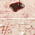 Liquide qui perle sur un jeté de canapé imperméable rouge et blanc