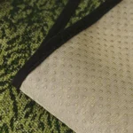 Dos à picots de silicone d'un jeté de canapé imperméable vert